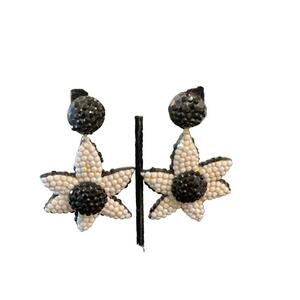 Earrings flower jet black & white  on ivory base clip 3”by 2”